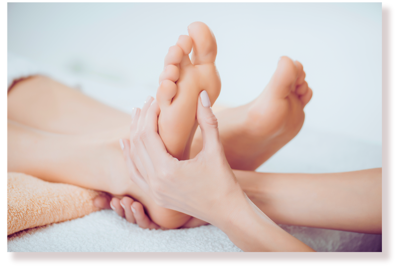 cropped view of masseur doing foot massage to adult woman in spa